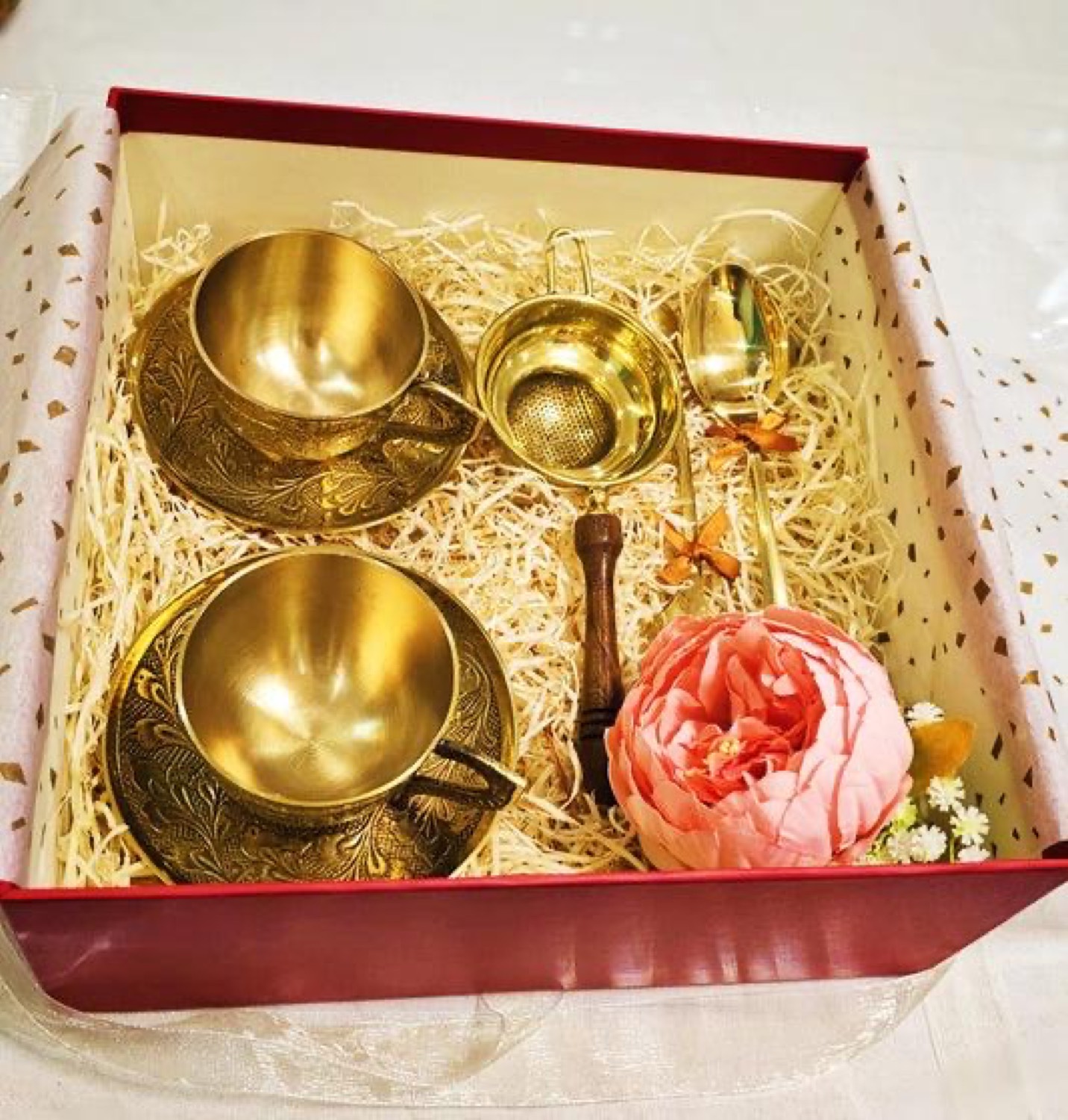 Corporate hamper of brass bowls in a presentation box with gold shred