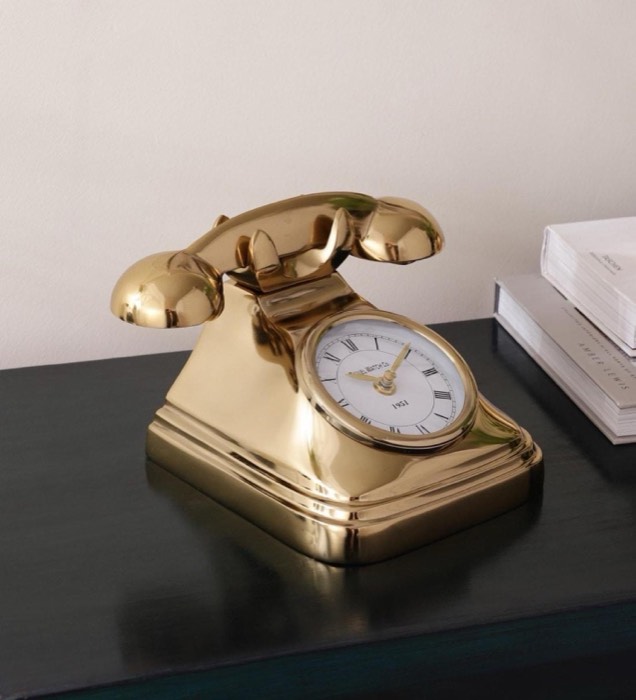 Brass desk clock in a vintage telephone form