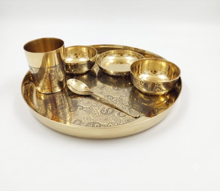 Brass thali with matching bowls, spoon and glass