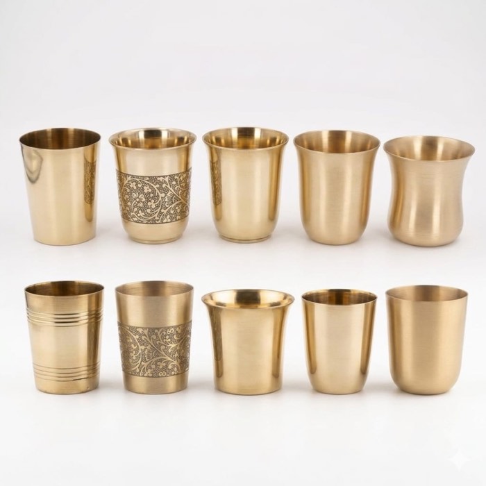 Row of brass tumblers in assorted engraved patterns